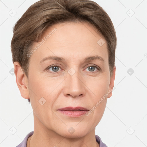 Joyful white adult female with short  brown hair and grey eyes