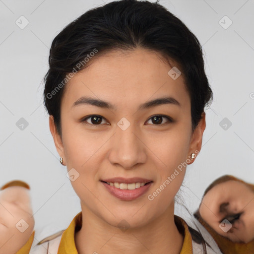 Joyful latino young-adult female with medium  brown hair and brown eyes