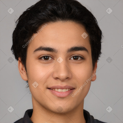 Joyful latino young-adult male with short  brown hair and brown eyes