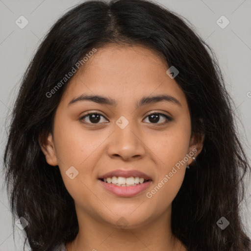 Joyful latino young-adult female with long  brown hair and brown eyes