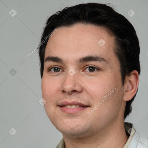 Joyful white young-adult male with short  black hair and brown eyes