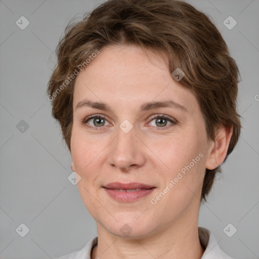 Joyful white adult female with short  brown hair and grey eyes