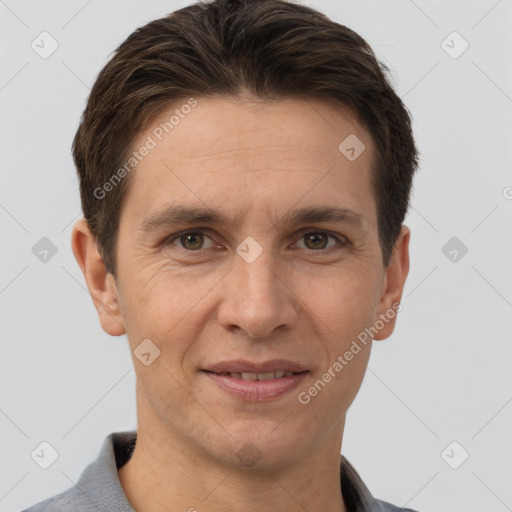 Joyful white adult male with short  brown hair and brown eyes