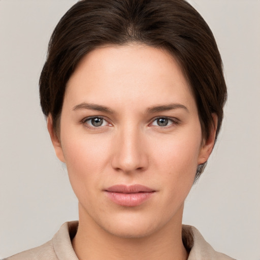 Neutral white young-adult female with short  brown hair and brown eyes