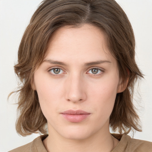 Neutral white young-adult female with medium  brown hair and grey eyes