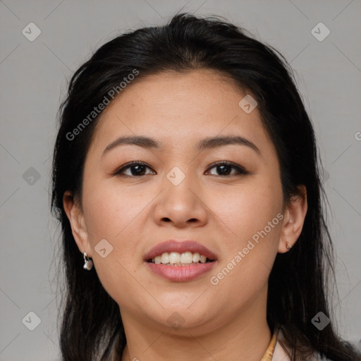 Joyful asian young-adult female with long  brown hair and brown eyes