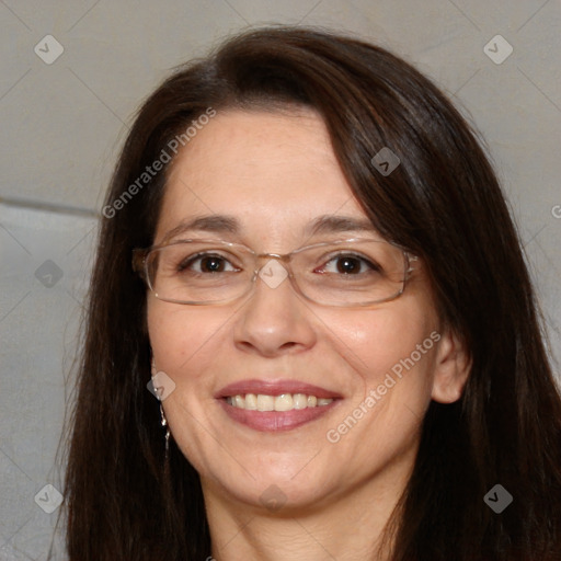 Joyful white adult female with long  brown hair and brown eyes