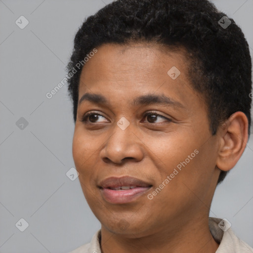 Joyful black young-adult male with short  black hair and brown eyes