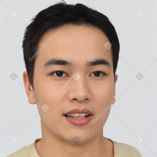 Joyful asian young-adult male with short  black hair and brown eyes