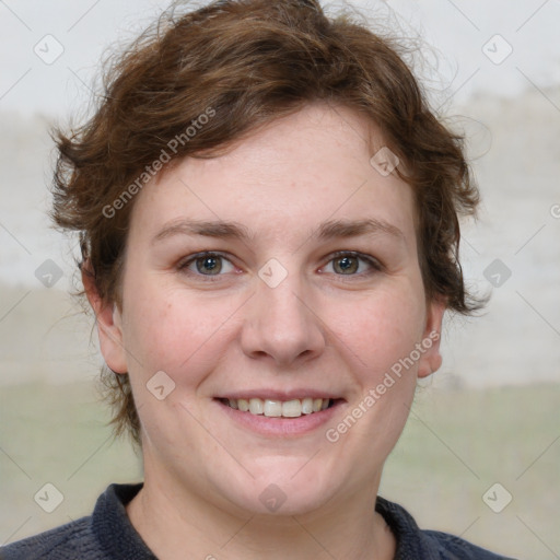 Joyful white young-adult female with medium  brown hair and blue eyes