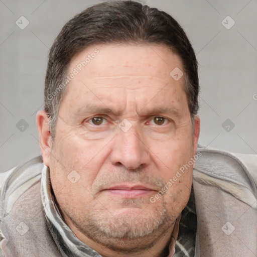 Joyful white adult male with short  brown hair and grey eyes