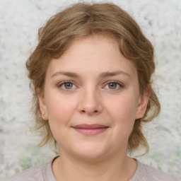 Joyful white young-adult female with medium  brown hair and blue eyes