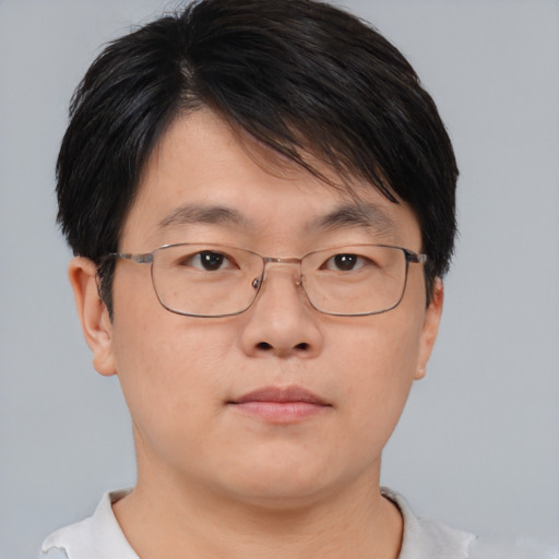Neutral asian adult male with short  brown hair and brown eyes