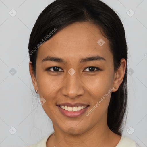 Joyful asian young-adult female with long  black hair and brown eyes