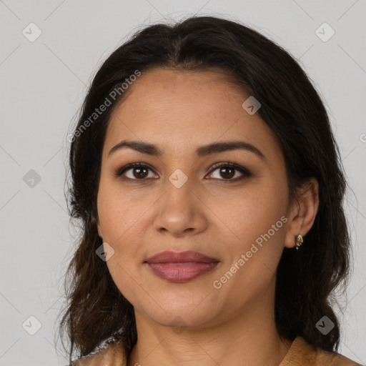 Joyful latino young-adult female with medium  brown hair and brown eyes