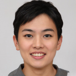 Joyful asian young-adult female with short  black hair and brown eyes