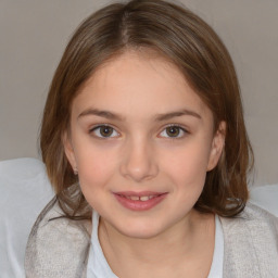 Joyful white child female with medium  brown hair and brown eyes