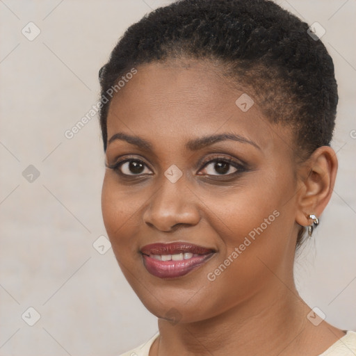 Joyful black young-adult female with short  brown hair and brown eyes