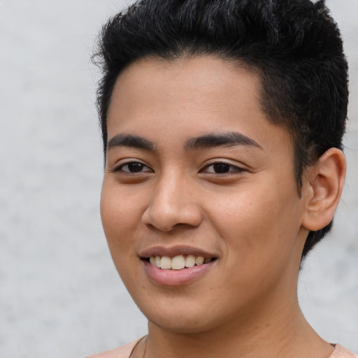 Joyful latino young-adult male with short  brown hair and brown eyes