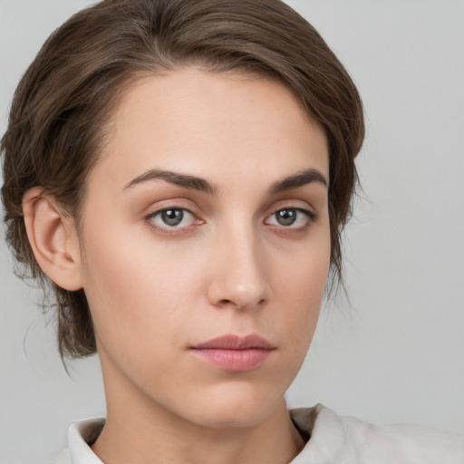 Neutral white young-adult female with medium  brown hair and grey eyes