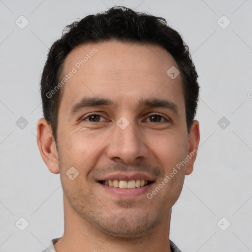 Joyful white young-adult male with short  brown hair and brown eyes