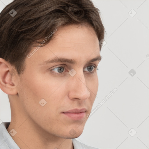 Neutral white young-adult male with short  brown hair and grey eyes