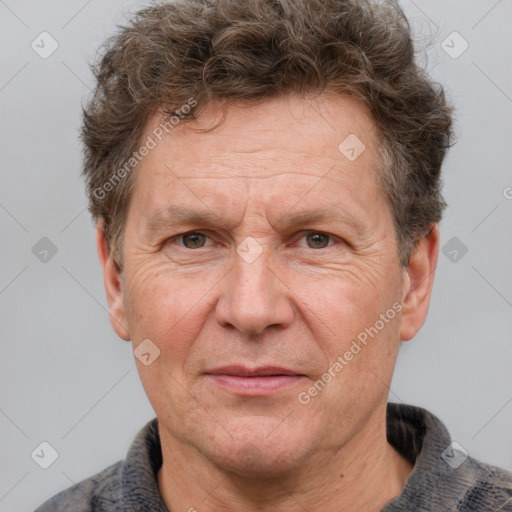 Joyful white middle-aged male with short  brown hair and grey eyes