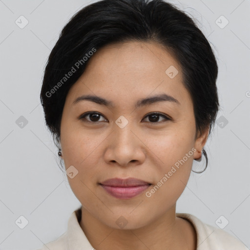 Joyful latino young-adult female with medium  brown hair and brown eyes