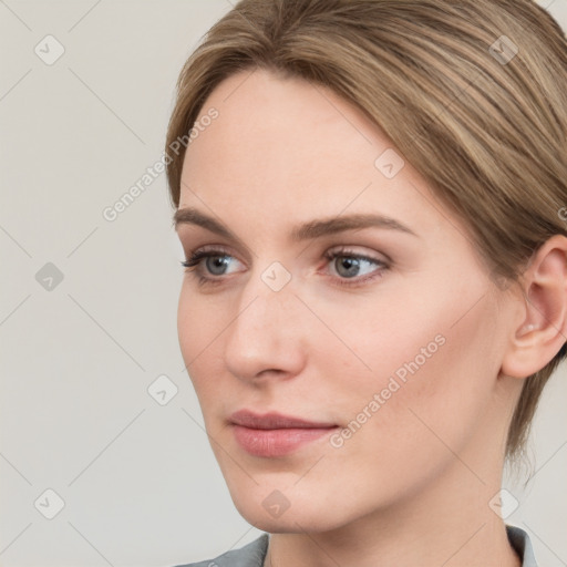 Neutral white young-adult female with medium  brown hair and grey eyes