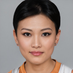 Joyful asian young-adult female with short  black hair and brown eyes