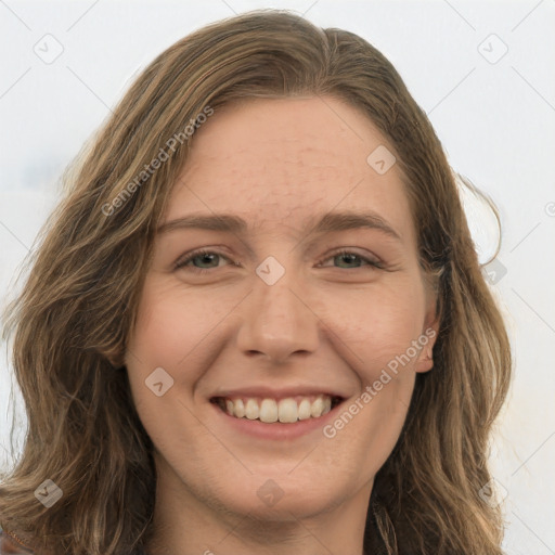 Joyful white young-adult female with long  brown hair and green eyes