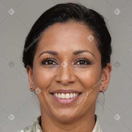 Joyful latino adult female with short  brown hair and brown eyes