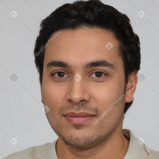 Joyful latino young-adult male with short  black hair and brown eyes