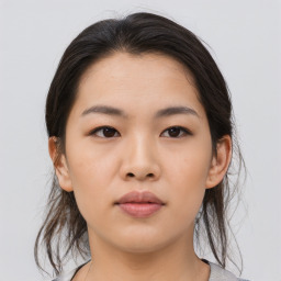 Neutral asian young-adult female with medium  brown hair and brown eyes