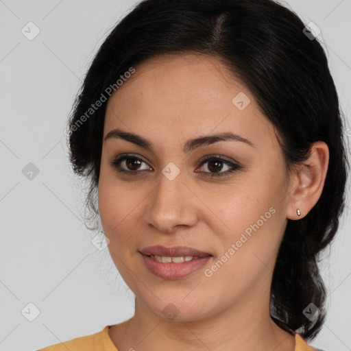 Joyful latino young-adult female with medium  brown hair and brown eyes