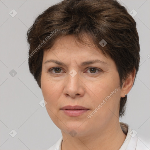 Joyful white adult female with short  brown hair and brown eyes