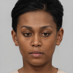 Neutral black young-adult female with short  brown hair and brown eyes