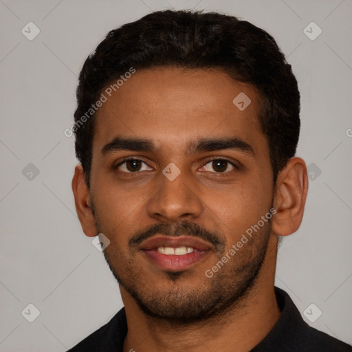 Joyful black young-adult male with short  black hair and brown eyes