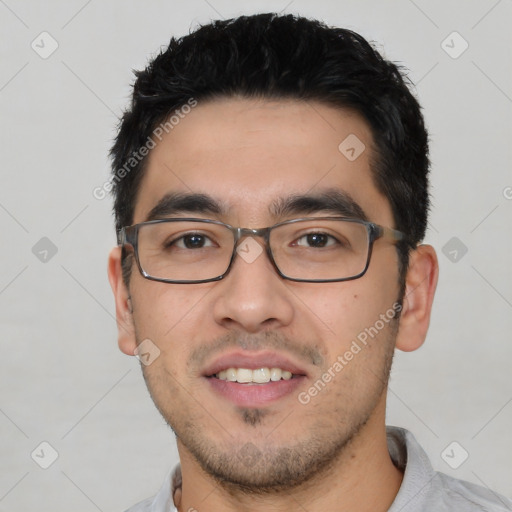 Joyful white young-adult male with short  black hair and brown eyes