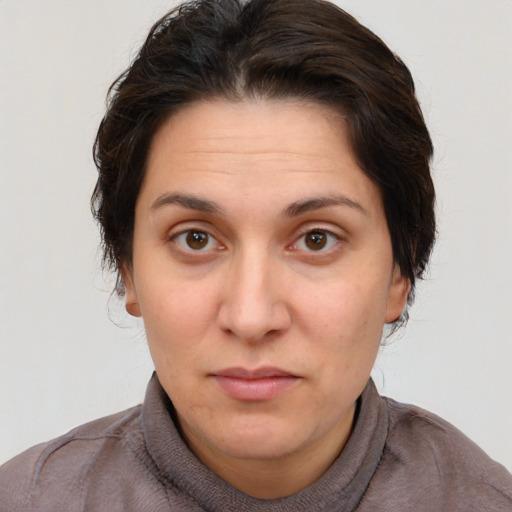 Neutral white adult female with short  brown hair and brown eyes