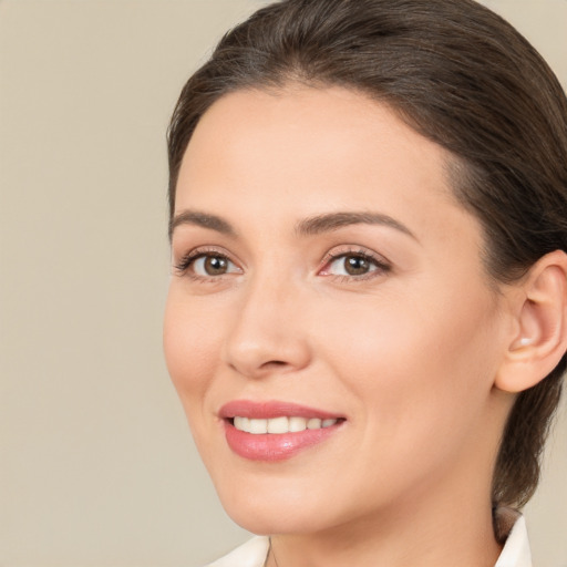 Joyful white young-adult female with medium  brown hair and brown eyes