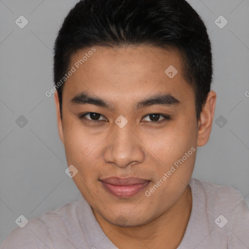 Joyful latino young-adult male with short  brown hair and brown eyes