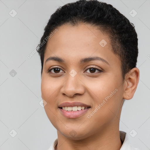 Joyful latino young-adult female with short  brown hair and brown eyes