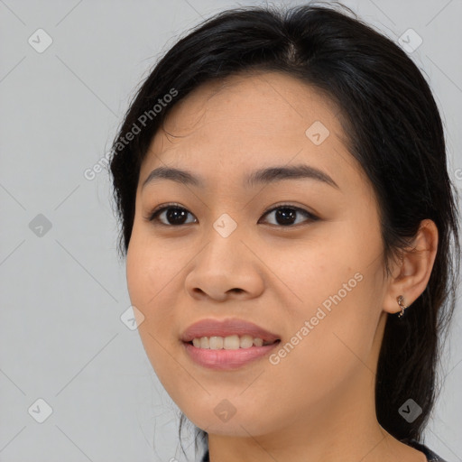 Joyful asian young-adult female with long  brown hair and brown eyes