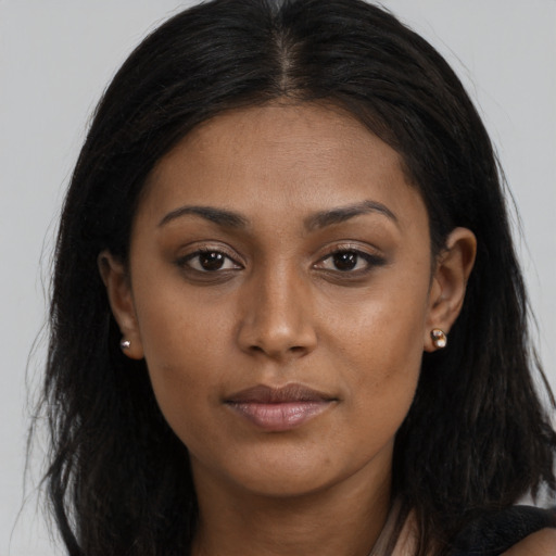 Neutral black young-adult female with long  brown hair and brown eyes