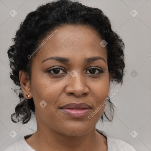 Joyful black adult female with medium  brown hair and brown eyes