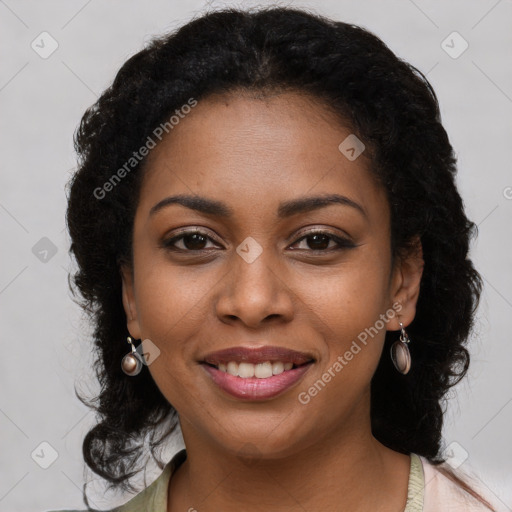 Joyful black young-adult female with long  brown hair and brown eyes