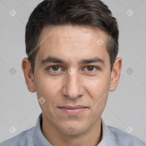 Joyful white adult male with short  brown hair and brown eyes