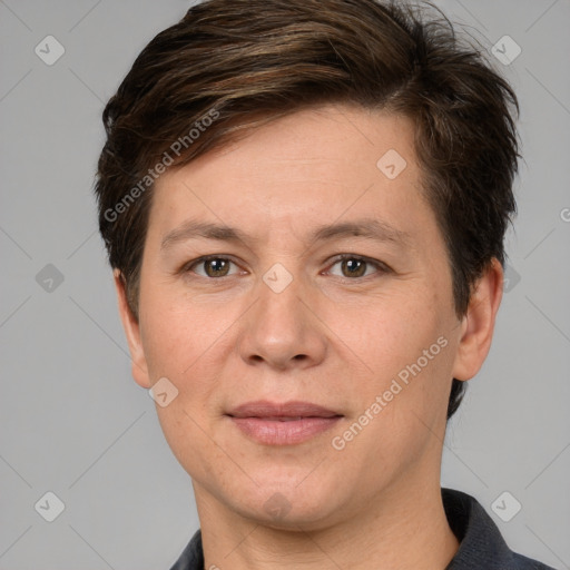 Joyful white adult female with short  brown hair and grey eyes