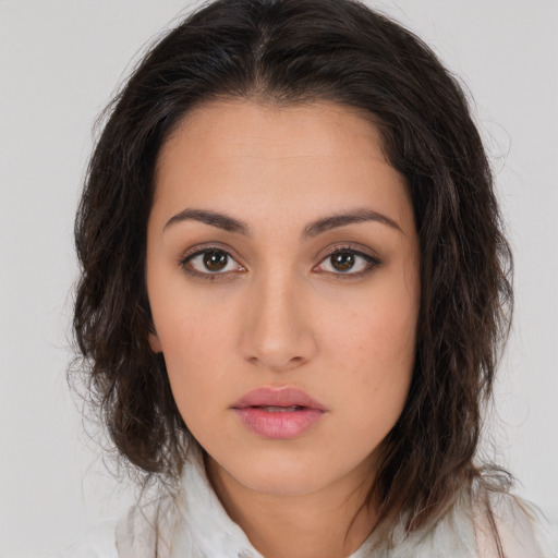 Neutral white young-adult female with long  brown hair and brown eyes